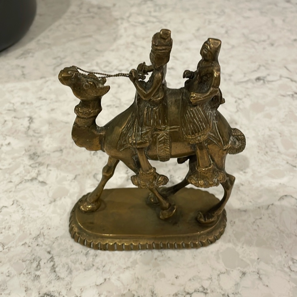 Metal camel with two riders dated 6/75